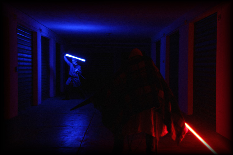 two jedi combat with lightsabers
